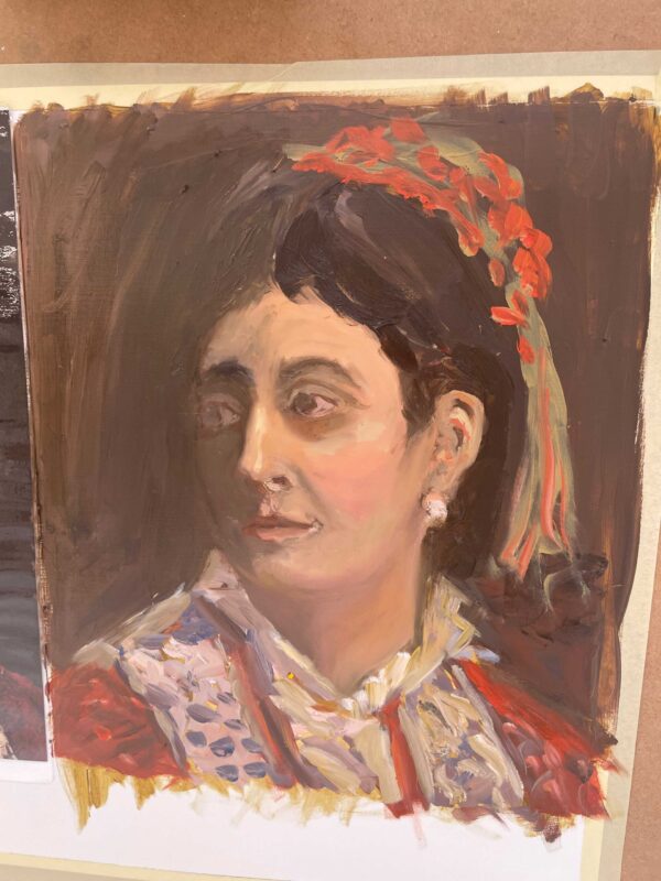 SEÑORA CON TOCADO ROJO